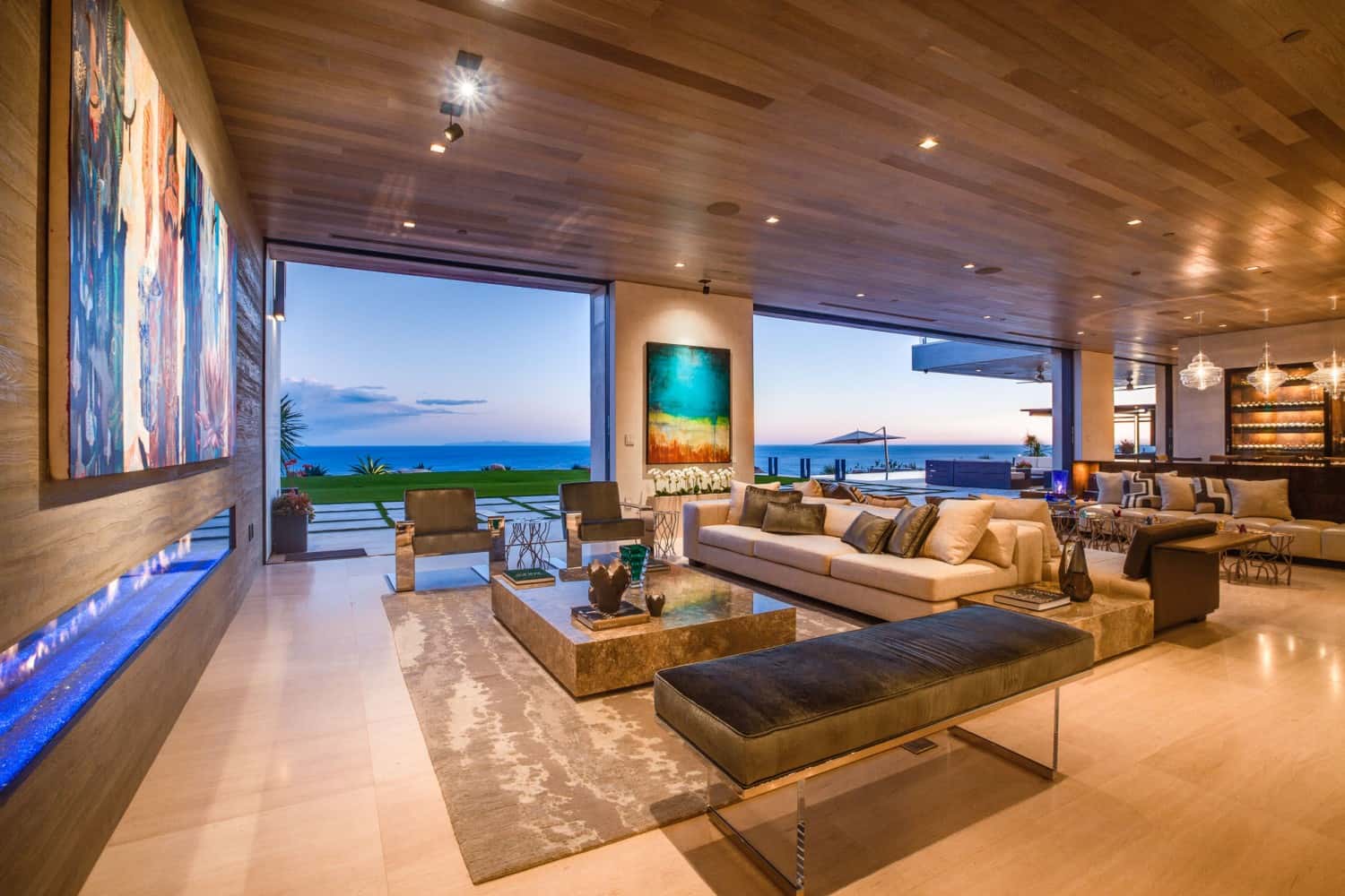 fance living room with ocean view through ceiling to floor windows | Gianna Provenzano
