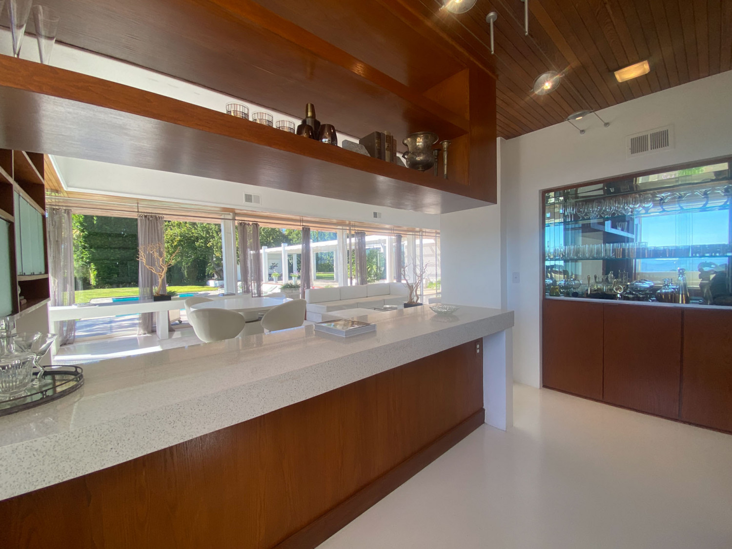 Bright kitchen with large island, white cabinetry and views of the surrounding hills