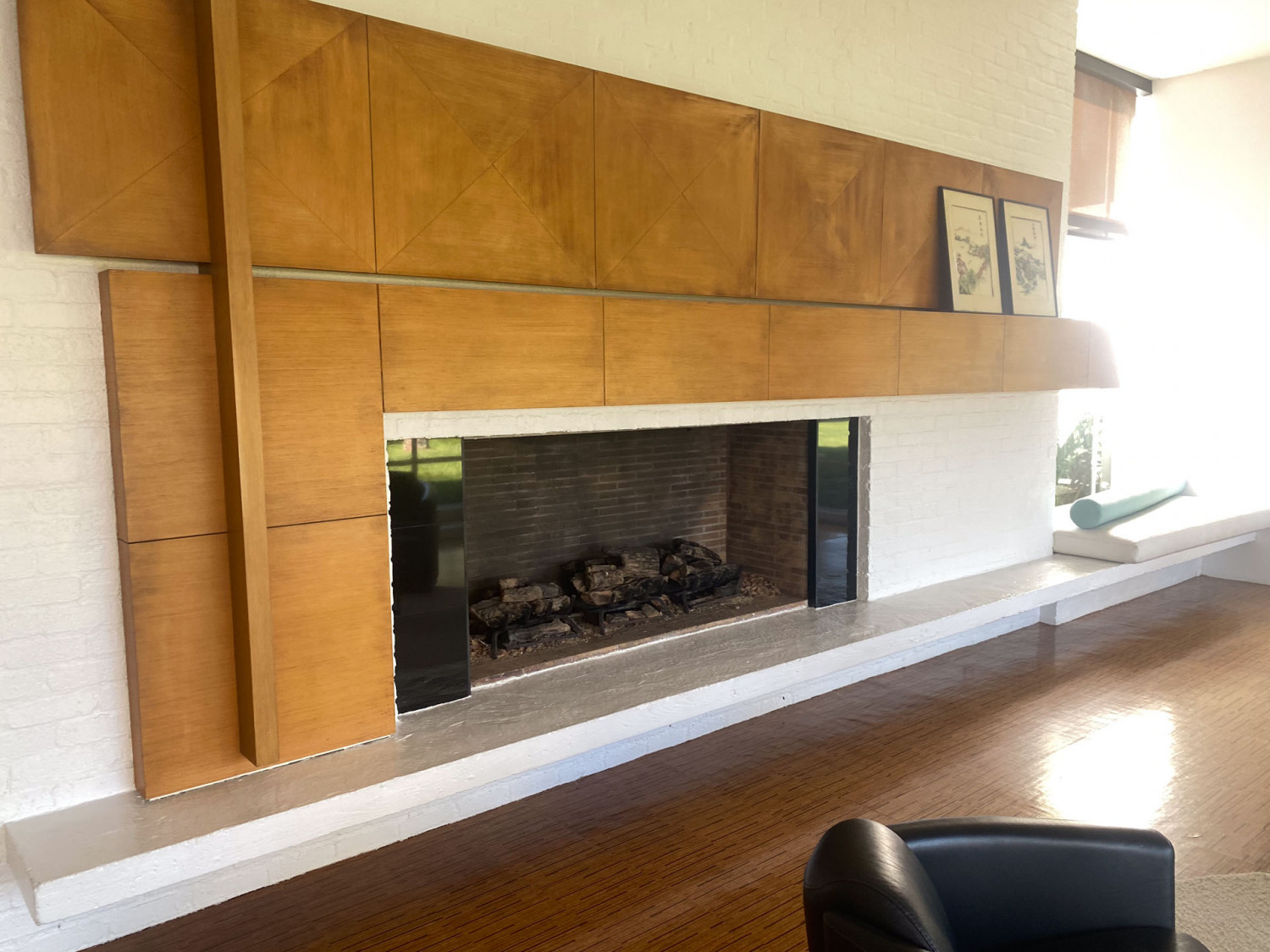 Mid-century fireplace with warm wood architectural detailing