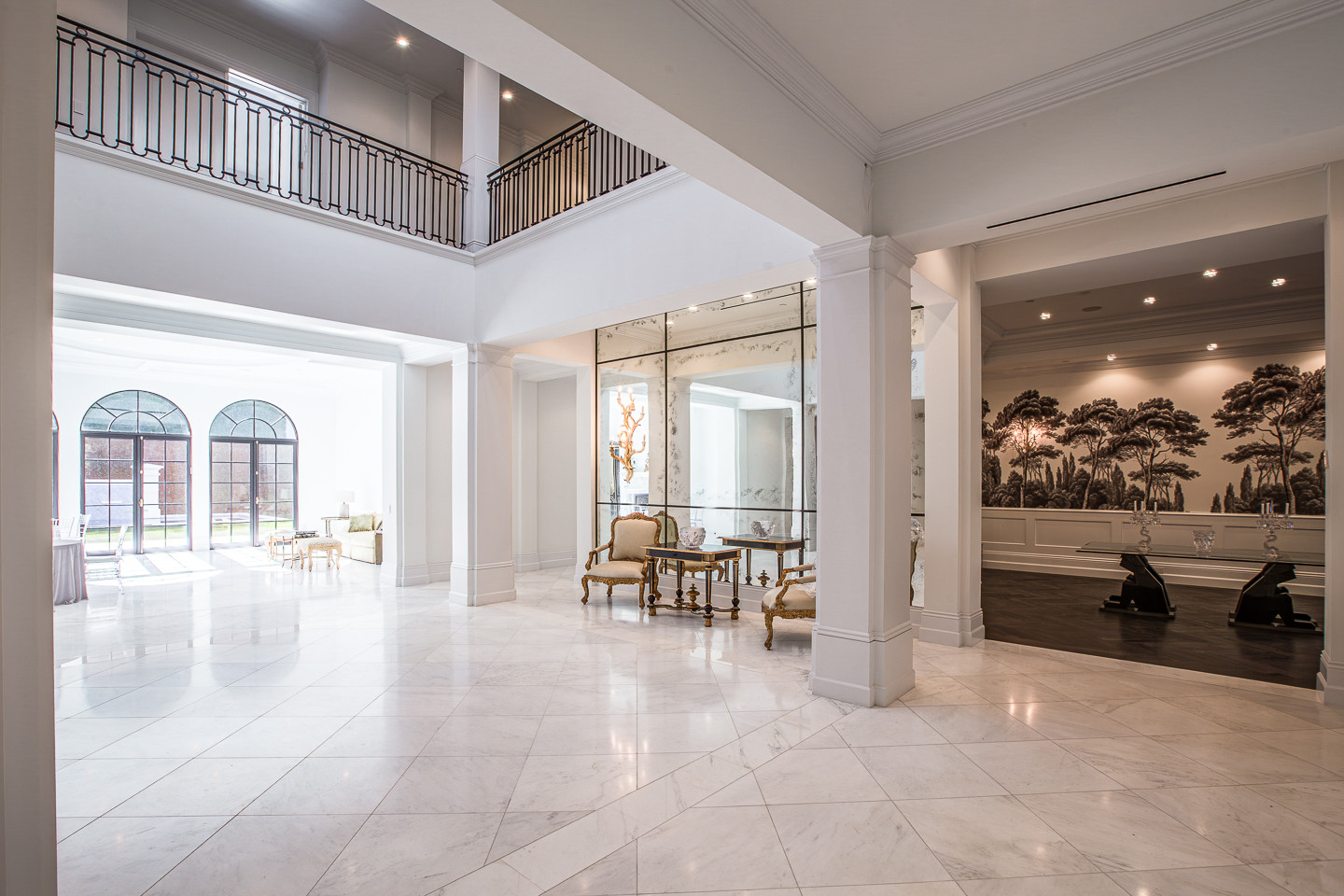 Grand marble foyer with soaring ceilings creating an impressive arrival at this Los Angeles private estate.