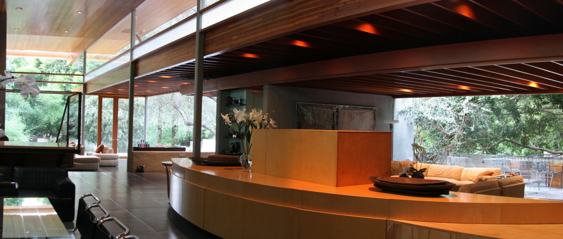 John Lautner great room featuring an open floor plan, wood ceilings, and floor-to-ceiling glass