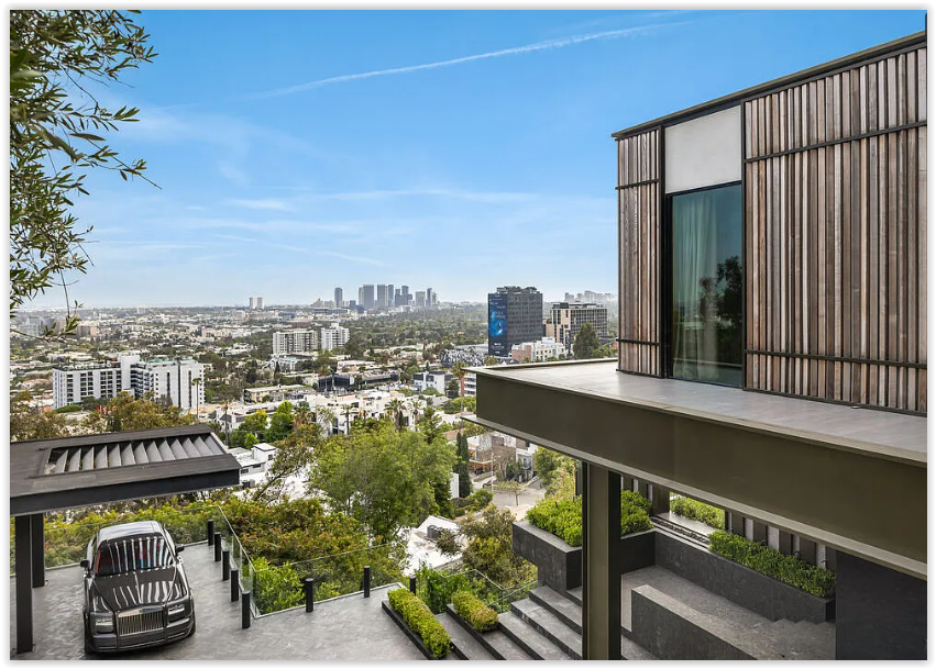 Luxury hillside estate with contemporary architecture, private motor court, and sweeping views of the Los Angeles skyline.