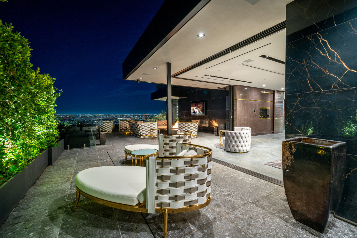 Luxury Bel Air estate with panoramic Los Angeles skyline, designer outdoor lounge, fire features, and seamless indoor-outdoor entertaining.