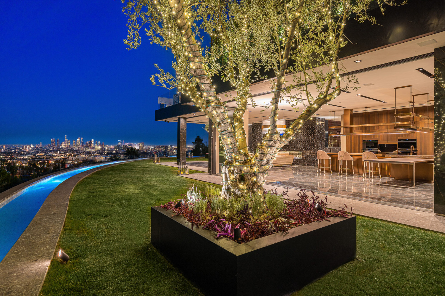 Luxury Bel Air estate featuring panoramic Los Angeles skyline views, designer architecture, illuminated landscaping, and seamless indoor-outdoor entertaining spaces.