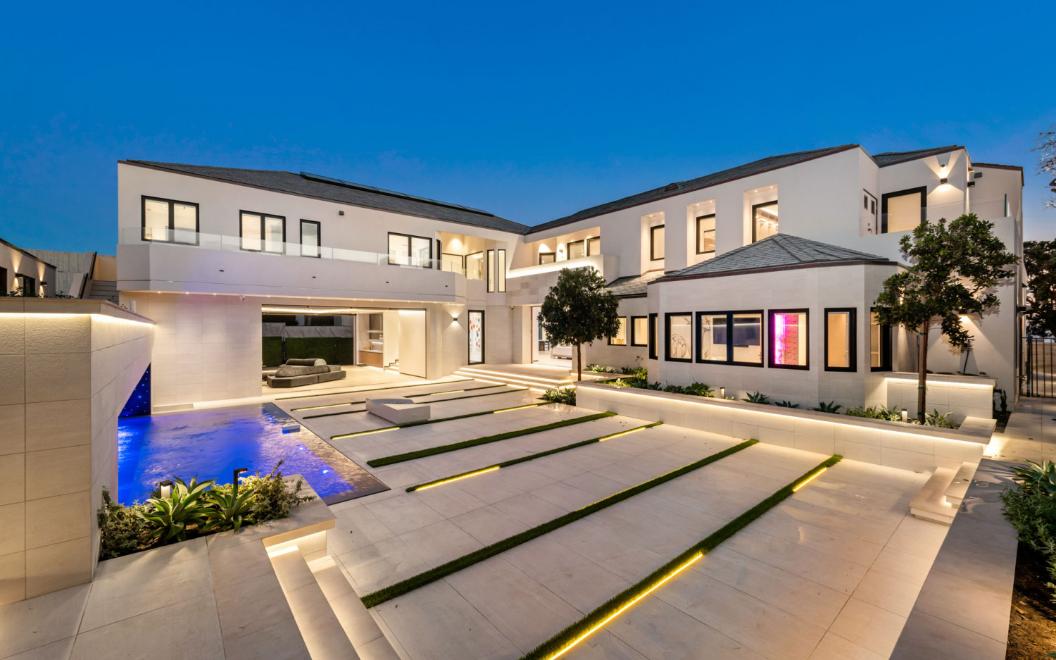 Modern Malibu beachfront estate exterior with clean architectural design and private courtyard