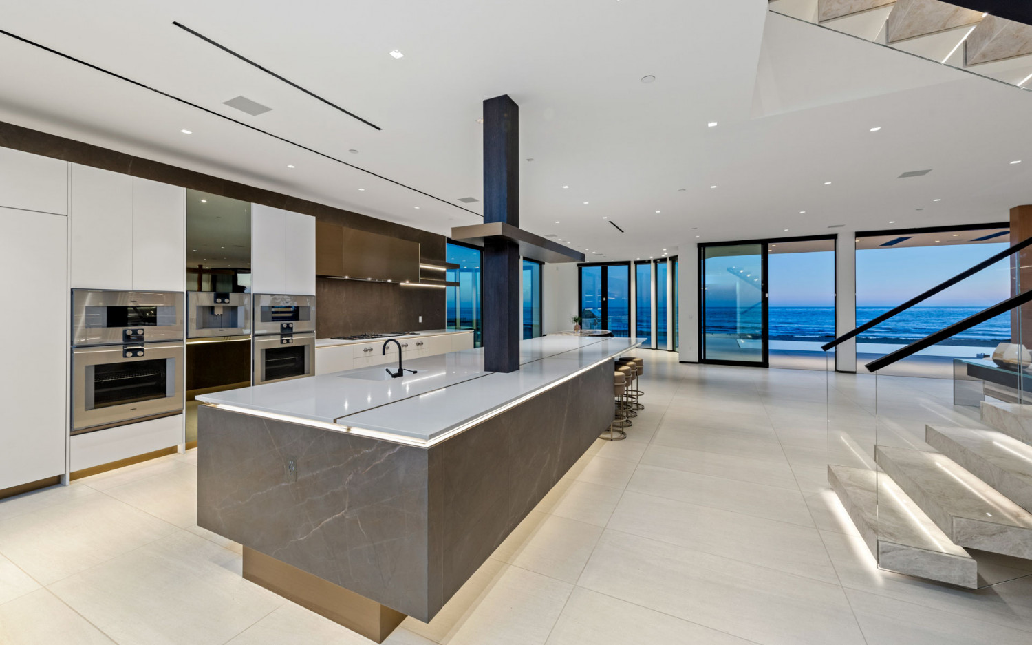 Contemporary kitchen inside Malibu beachfront estate with ocean backdrop