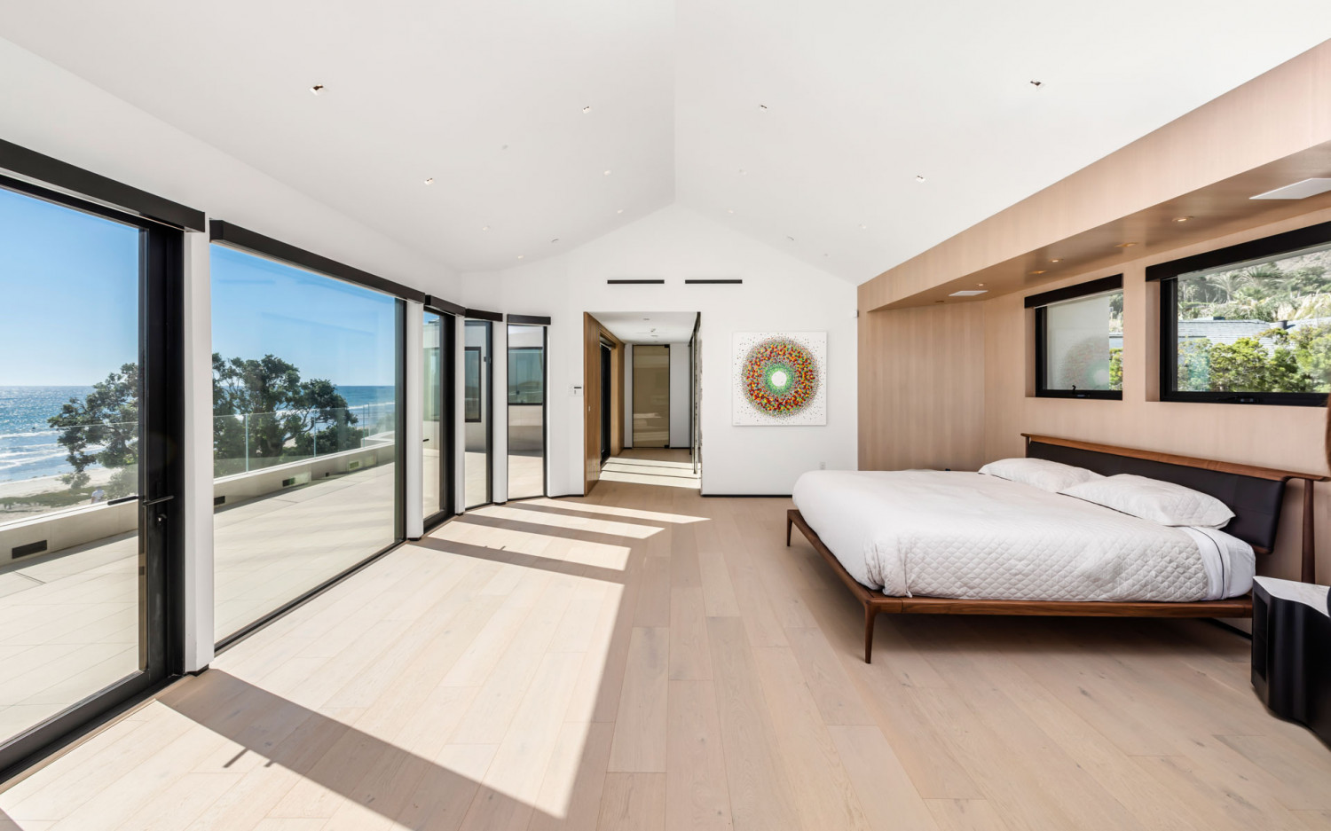 Ocean view bedroom in modern Malibu beachfront estate with natural light