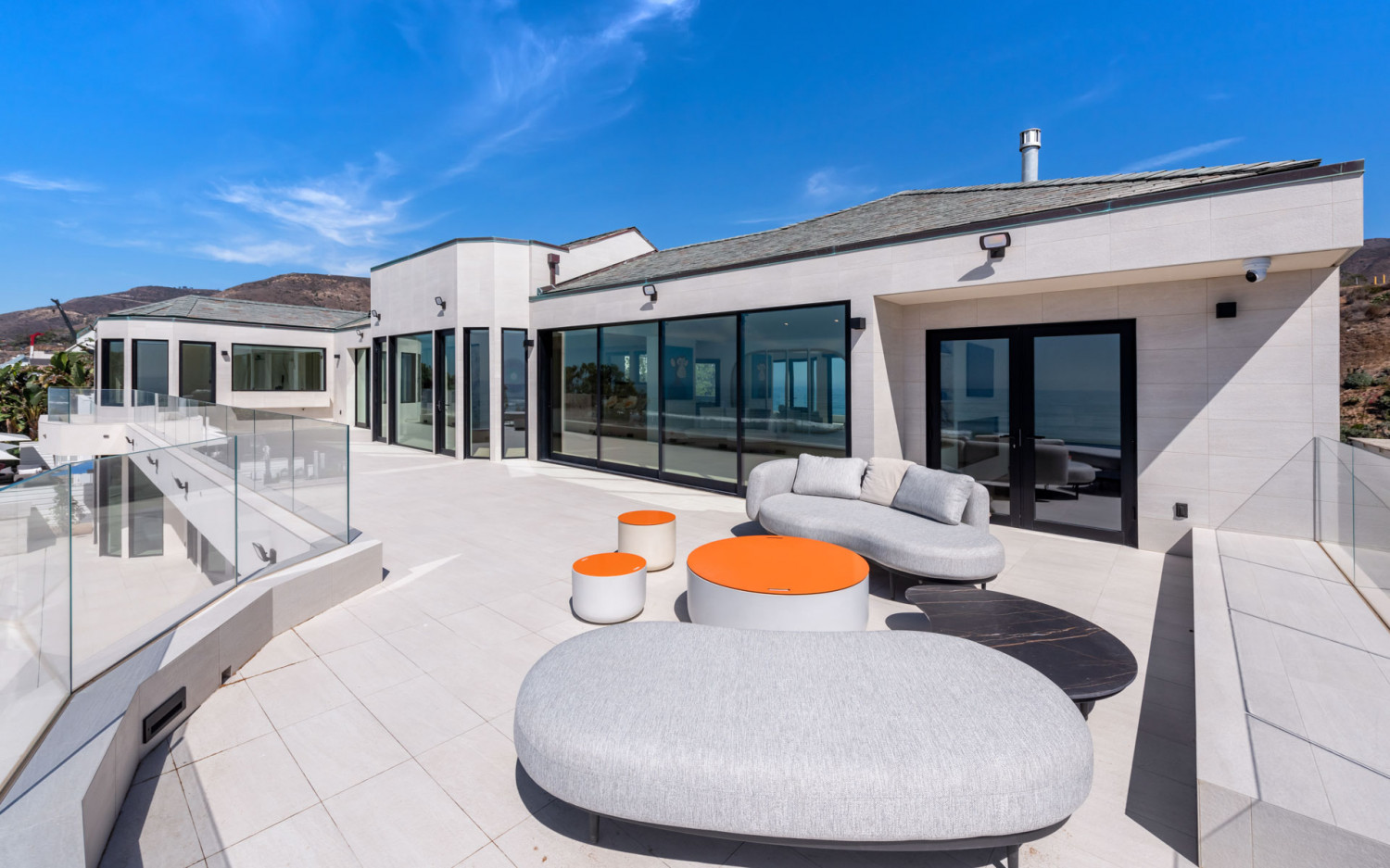 Outdoor lounge seating area at Malibu beachfront estate overlooking the ocean