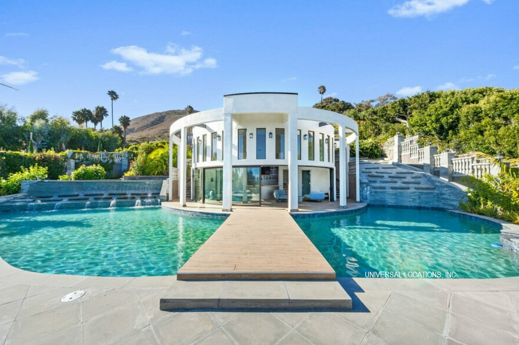 Iconic circular pool pavilion with a resort-style pool at a luxury Malibu ocean view estate.