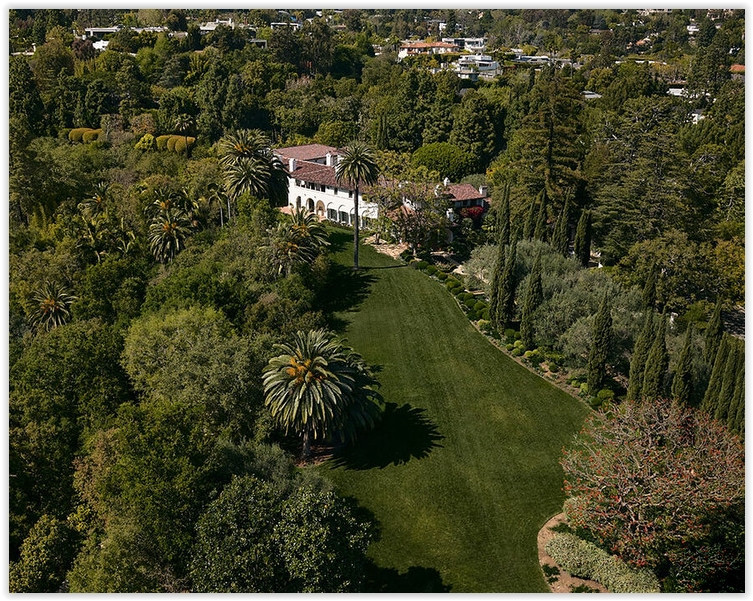 Bel Air Mediterranean estate with expansive lawn, mature palms and landscaped gardens