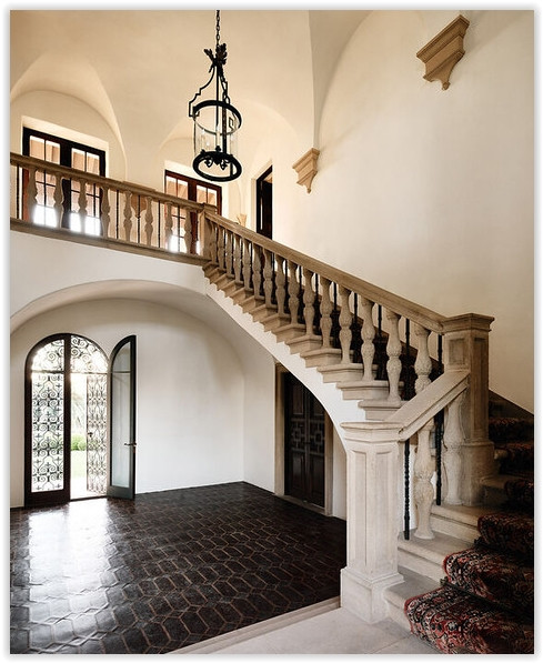Grand staircase and arched foyer inside C199-BA Mediterranean estate in Bel Air