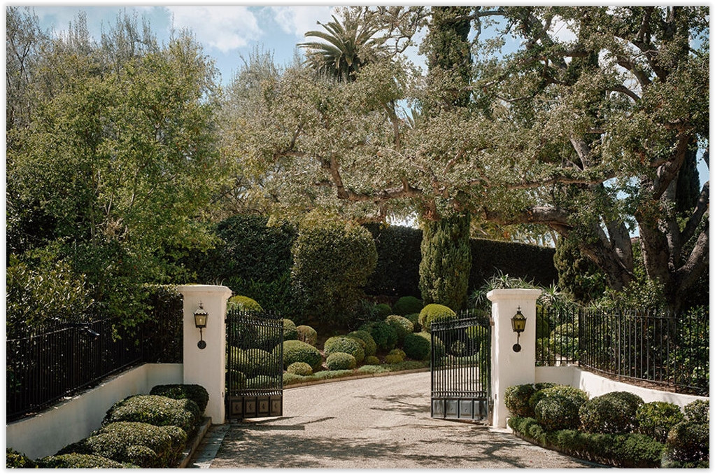 Private driveway gates and manicured landscaping at C199-BA Bel Air estate