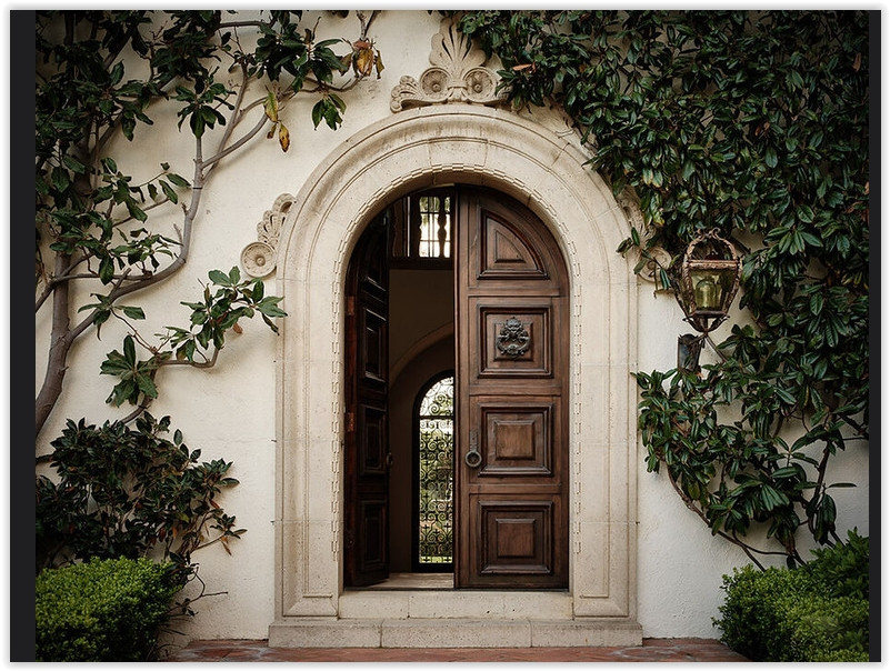 Bel Air Mediterranean estate with arched architecture, lawn and garden setting
