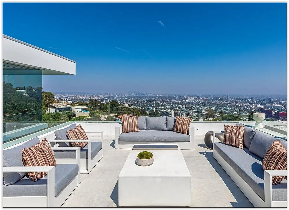 Modern outdoor lounge and terrace with sweeping panoramic views across Los Angeles