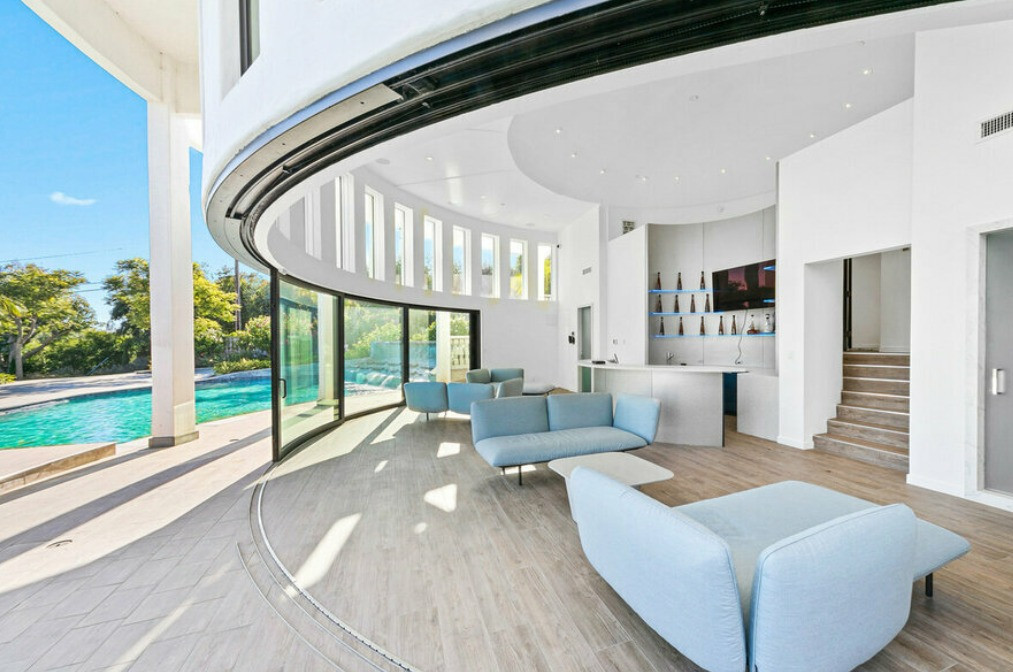 Sophisticated living space with floor-to-ceiling glass and ocean views