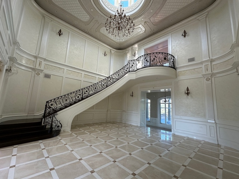 Elegant Grand Foyer with Curved Staircase at Luxury Pasadena Estate