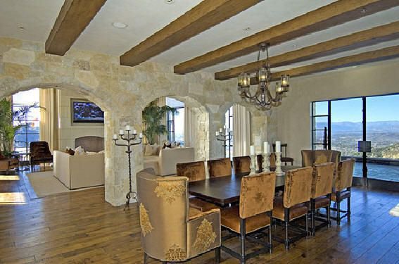 Formal dining room with stone architecture and expansive mountain views