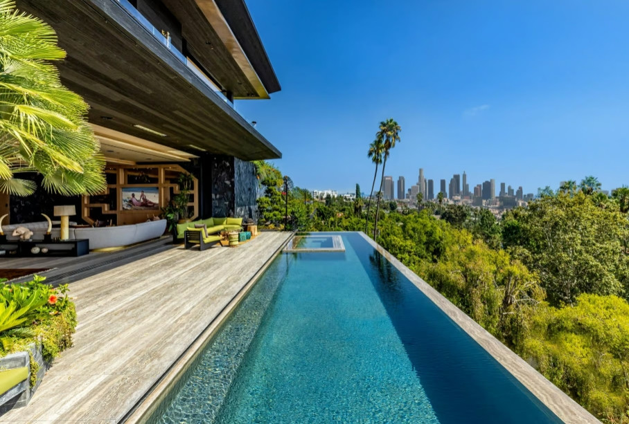 Infinity pool overlooking Downtown Los Angeles from modern hillside estate