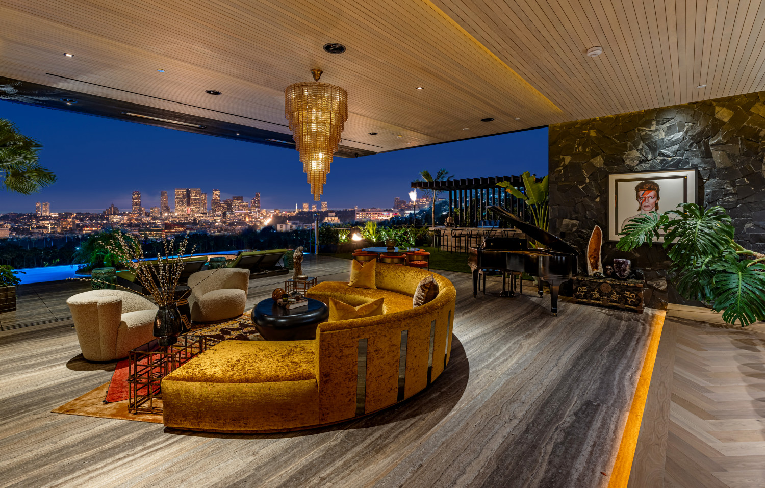 Expansive indoor-outdoor lounge with grand piano and city views