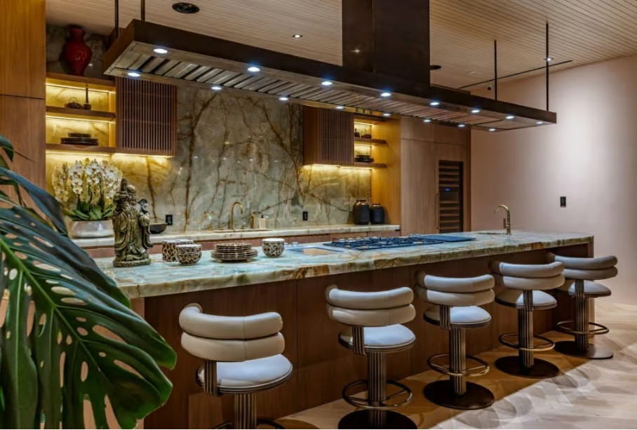 Contemporary kitchen with stone island and bar seating