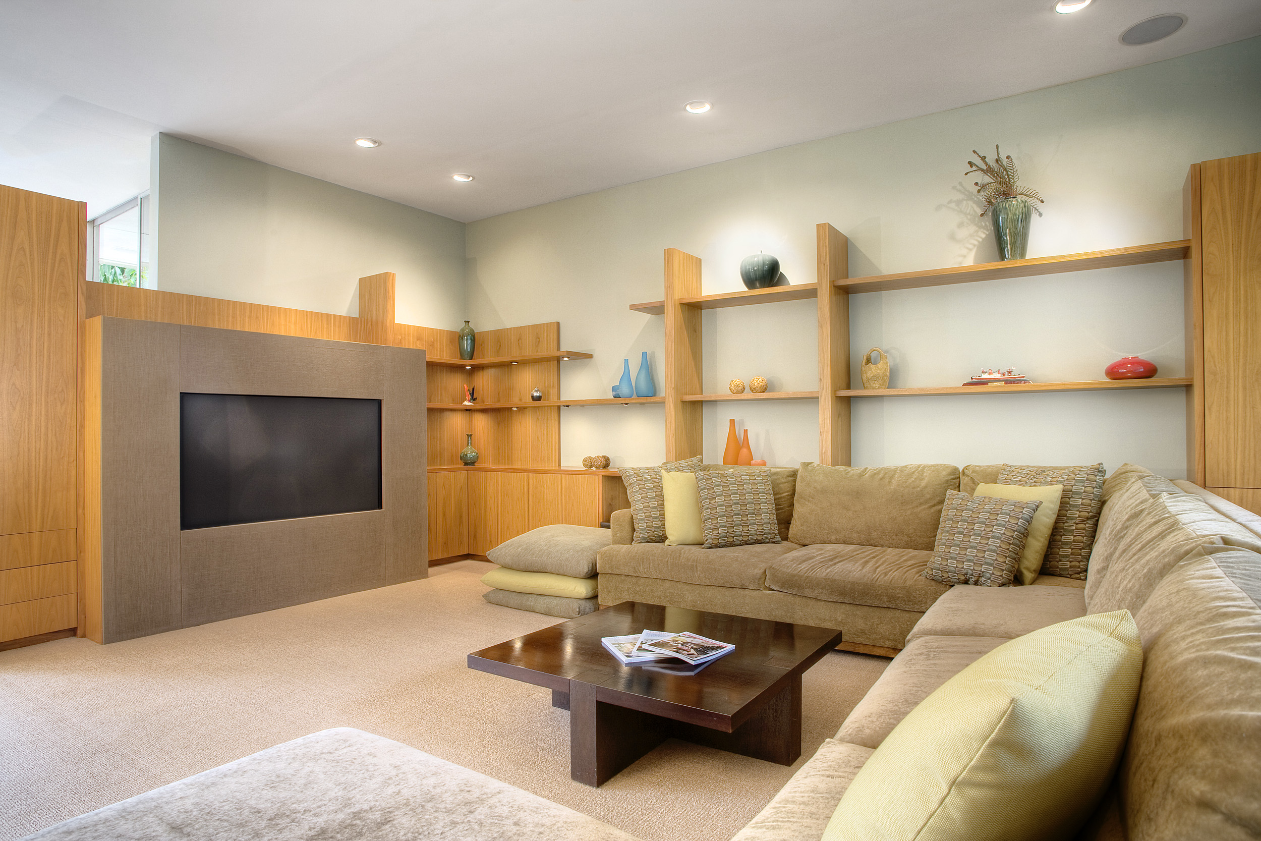 Comfortable den with built-in shelving at Beverly Hills private event home