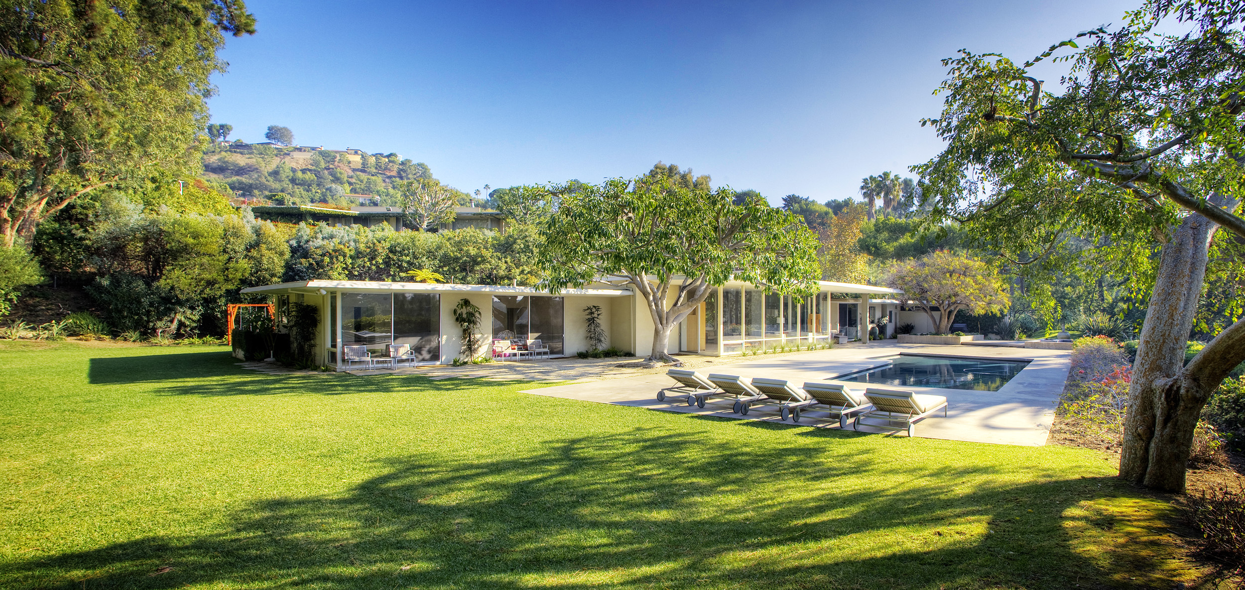 Landscaped gardens and pool at modern Beverly Hills private event home