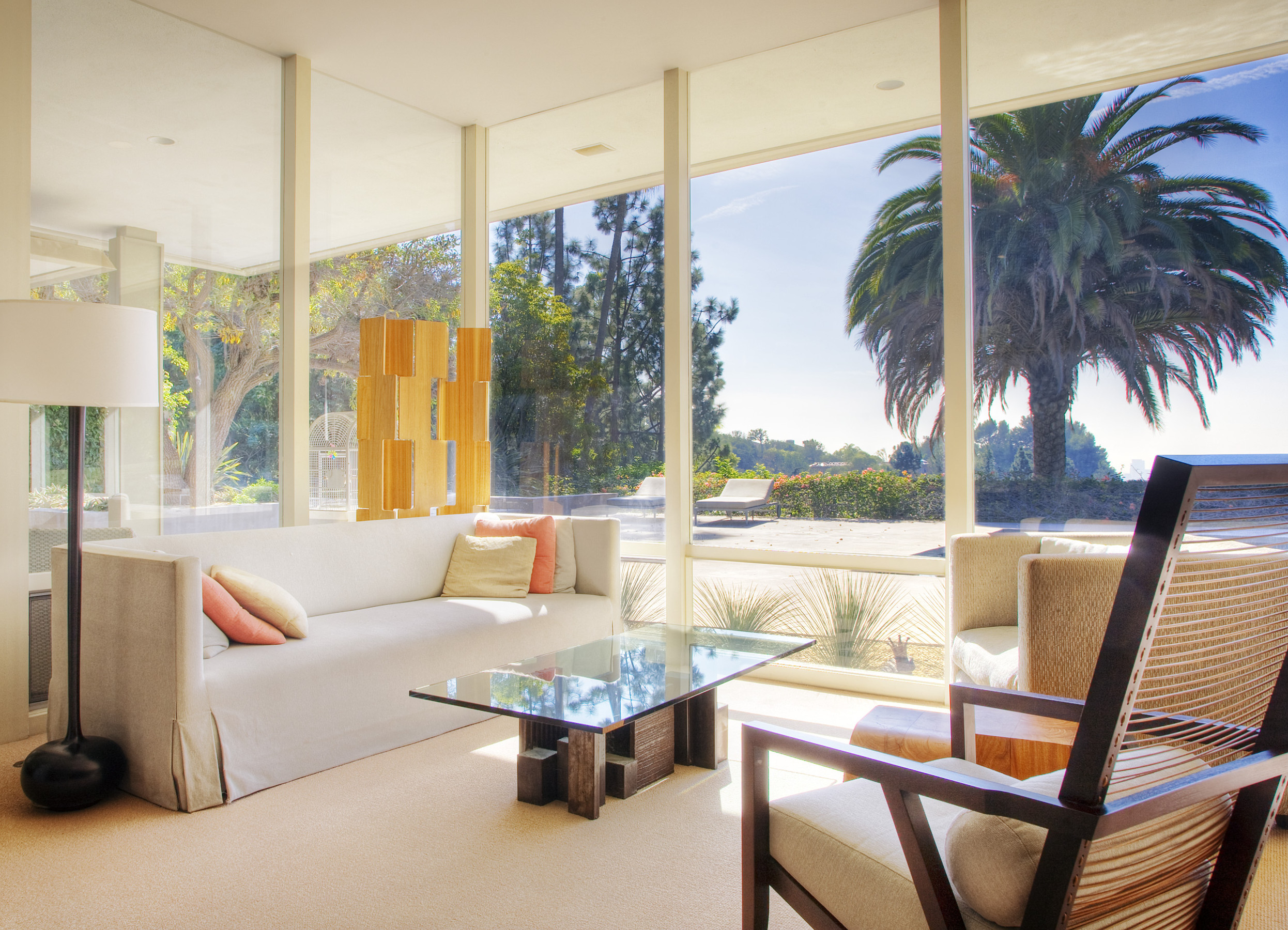 Beverly Hills living room with floor-to-ceiling windows and palm tree views